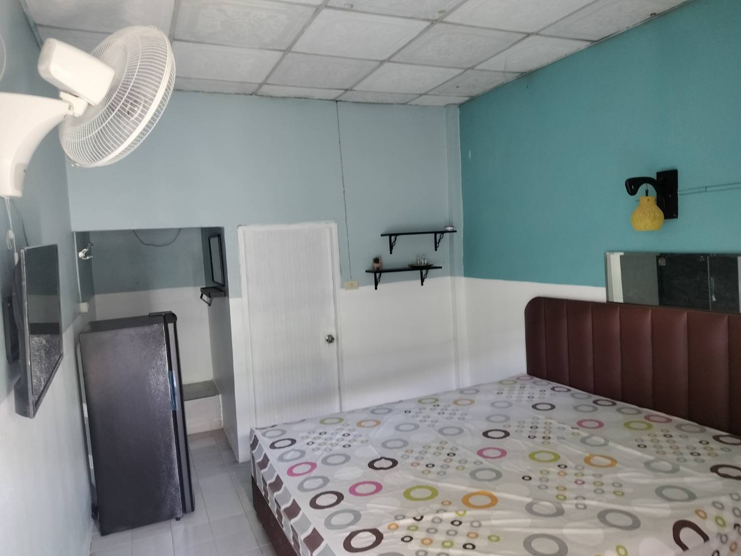 Standard Double Room with double bed and teal wall
